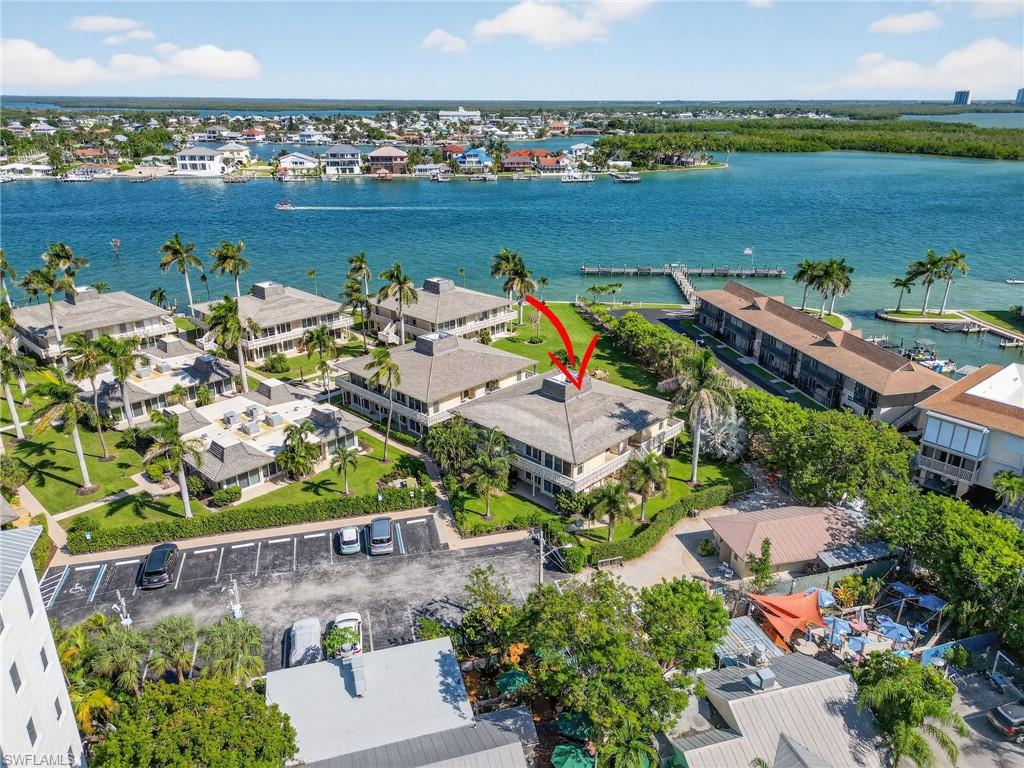 Aerial view of residential area featuring a large body of water