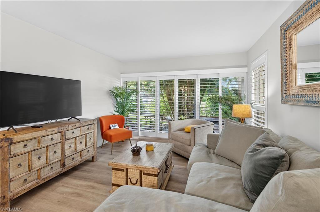 Living area with light wood finished floors