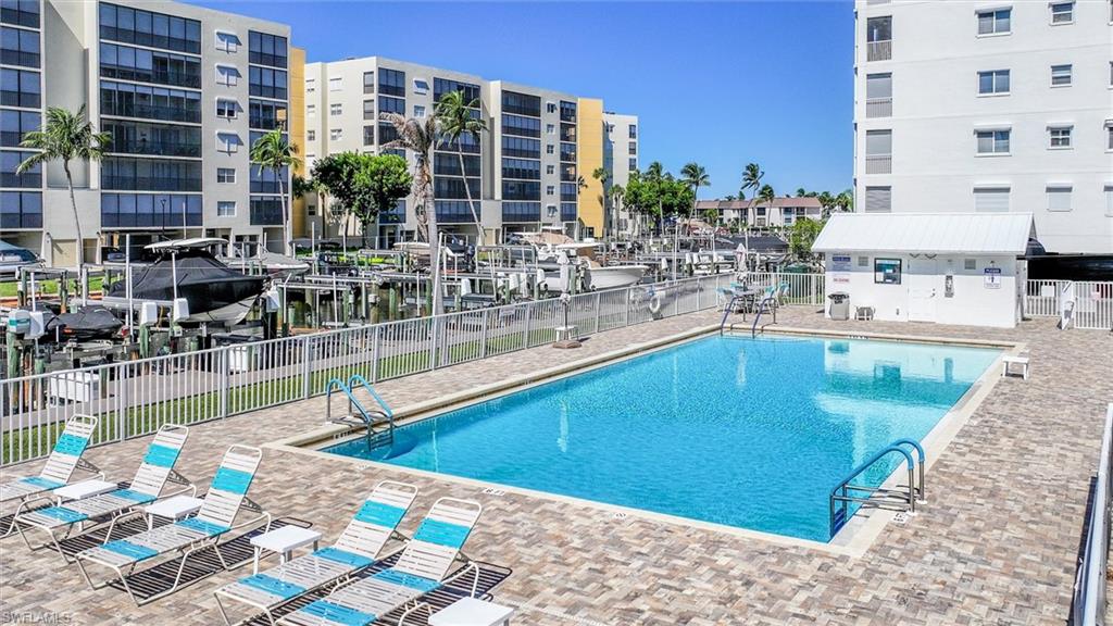 Community pool featuring a patio