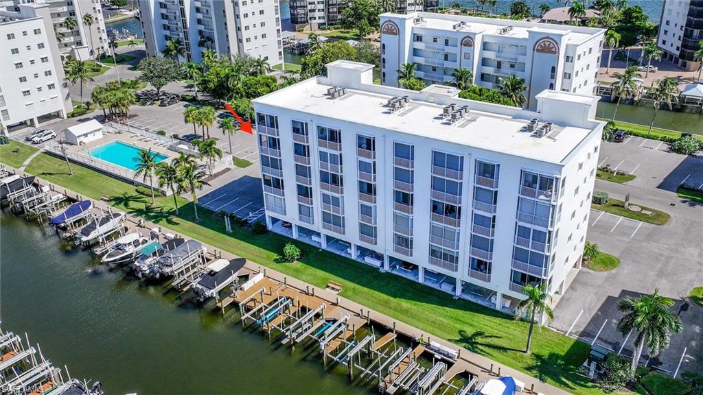 Aerial view of apartment complex and a large body of water