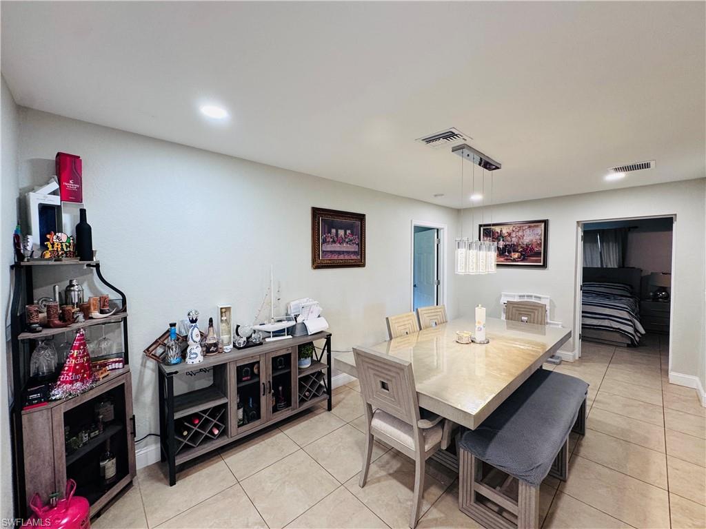 Dining room featuring light tile patterned floors