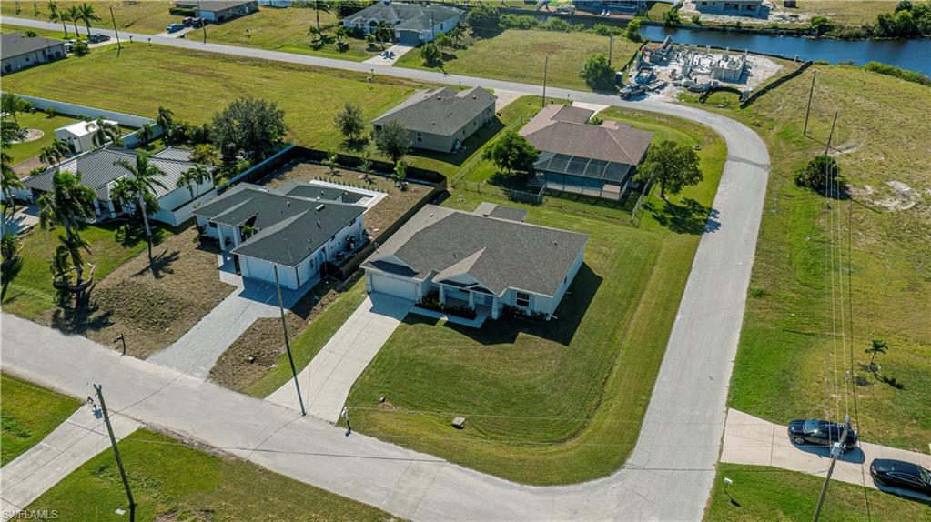 Aerial perspective of suburban area with a large body of water