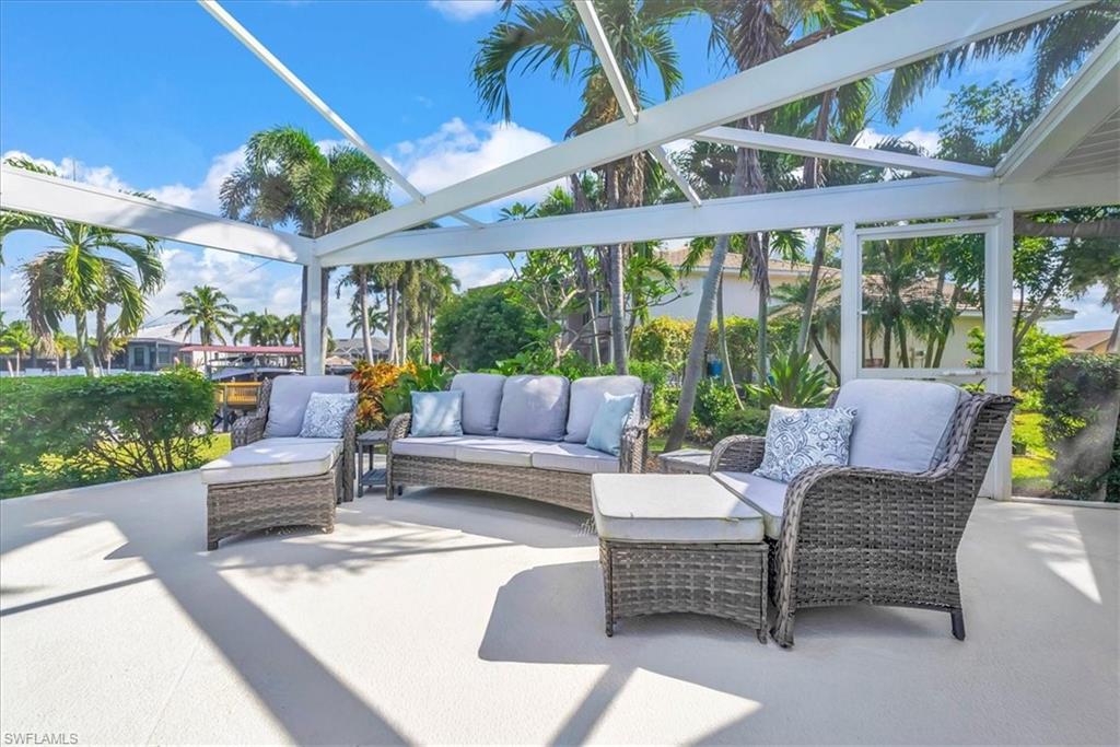 View of patio / terrace featuring a lanai