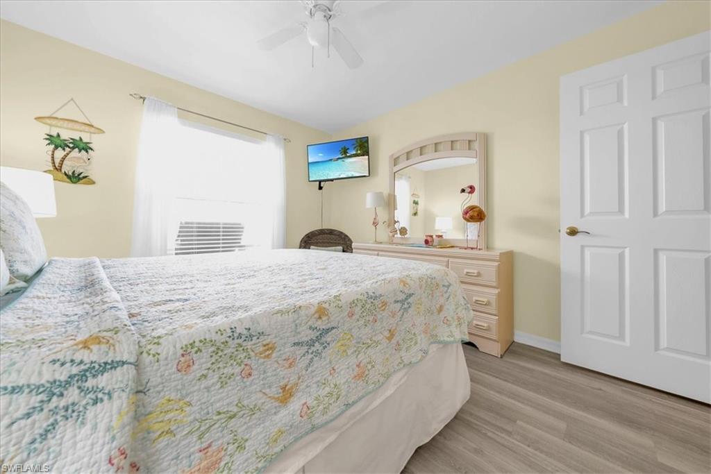 Bedroom with light wood finished floors and ceiling fan