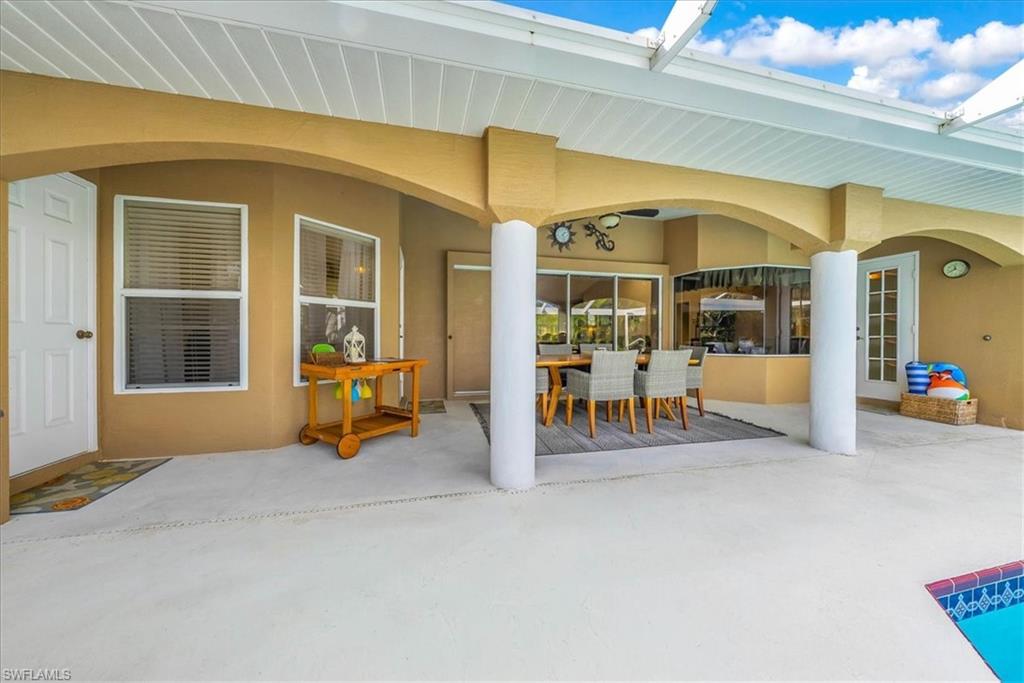 View of patio with outdoor dining area