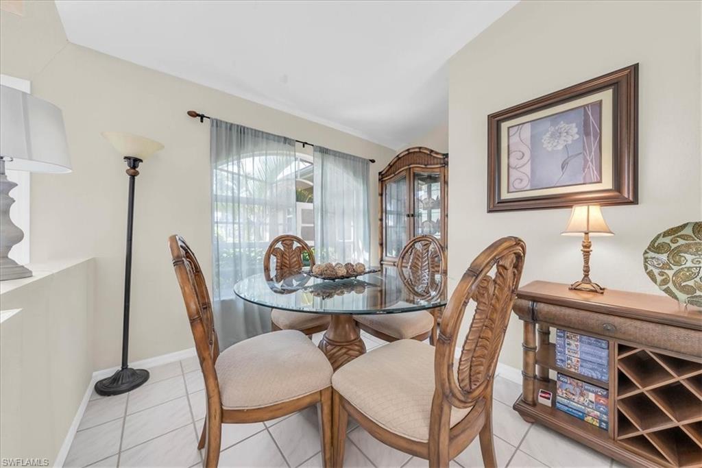 Dining space featuring light tile patterned floors