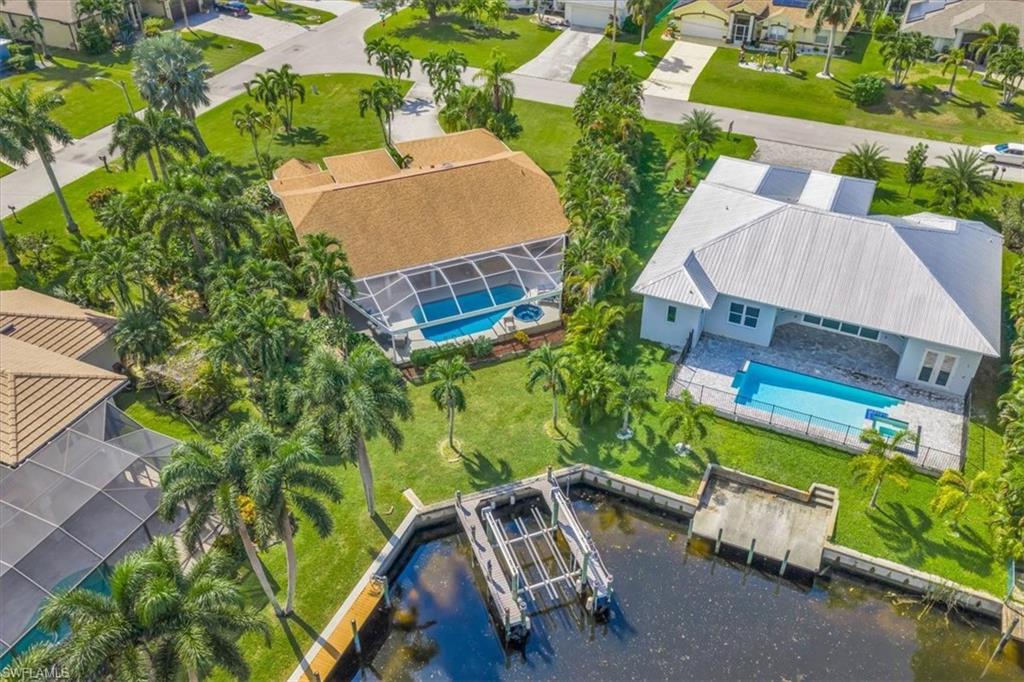 Aerial perspective of suburban area with a pool