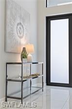 Entryway featuring light tile patterned floors