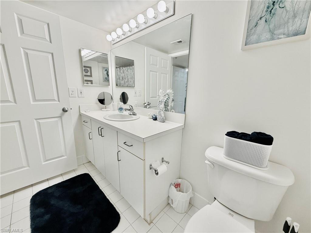 Bathroom with vanity and light tile patterned floors