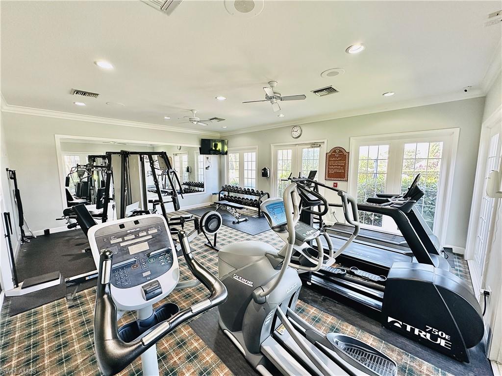 Workout area with ornamental molding, recessed lighting, a ceiling fan, and french doors