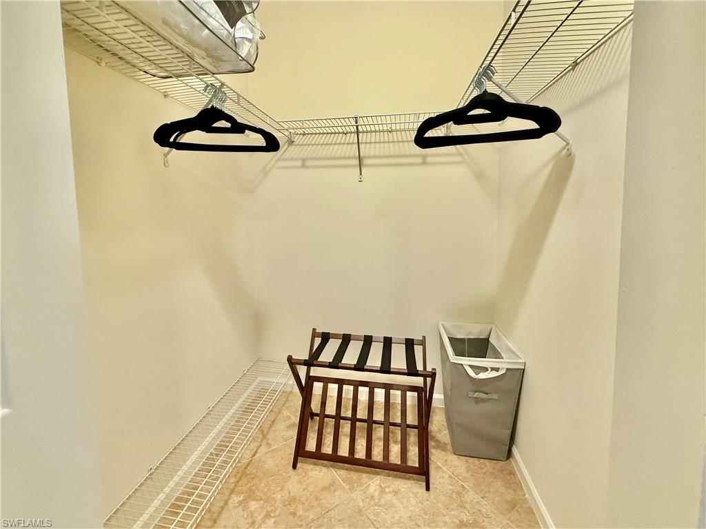 Spacious closet with tile patterned floors