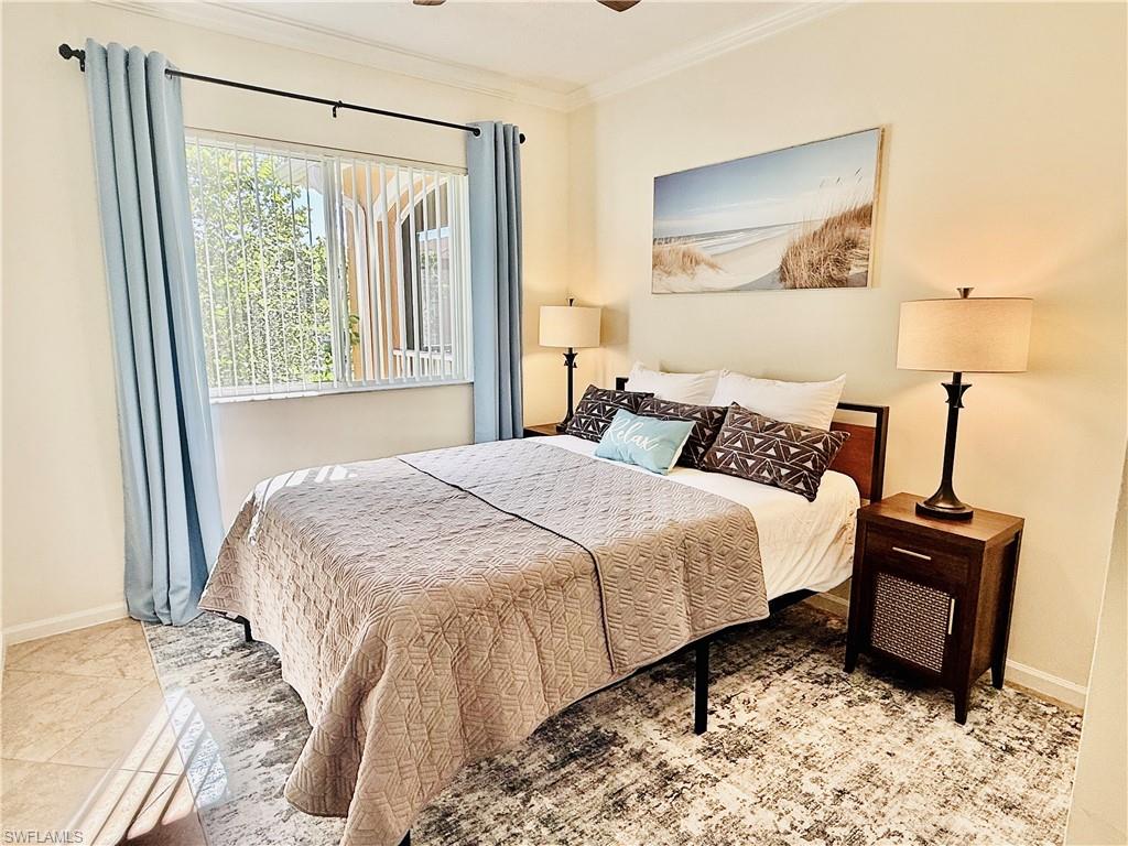 Bedroom featuring baseboards and ornamental molding