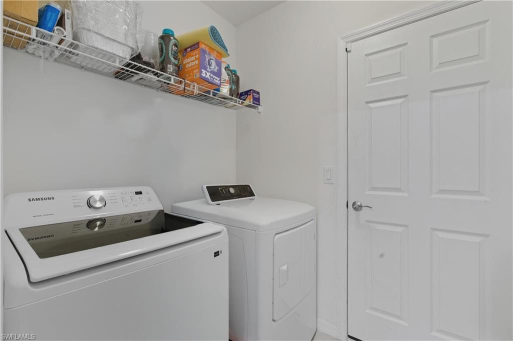 Laundry room featuring washing machine and clothes dryer