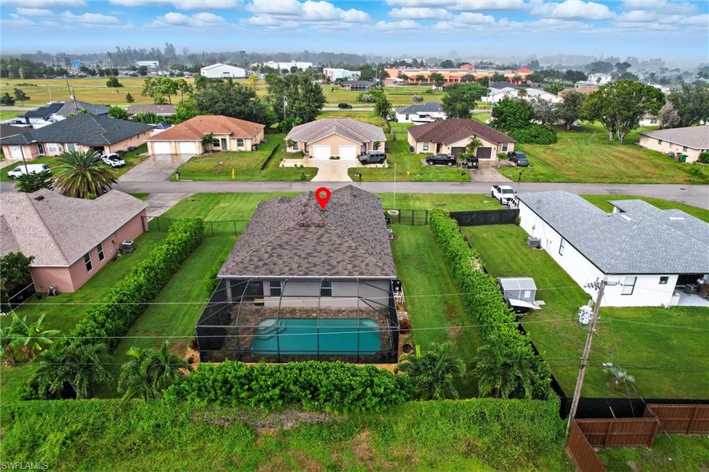 Aerial view of residential area with a pool area