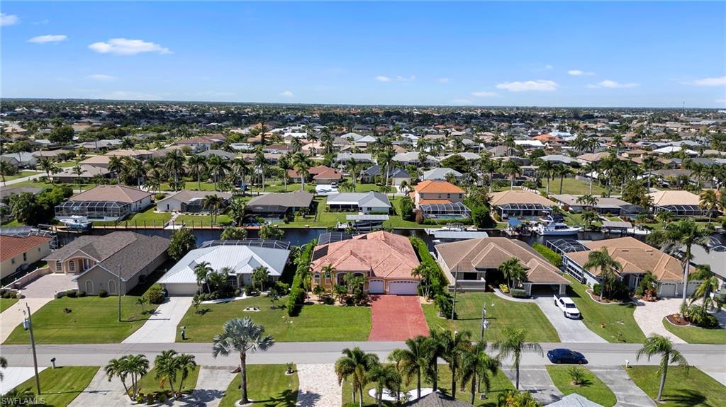 Aerial perspective of suburban area with a large body of water