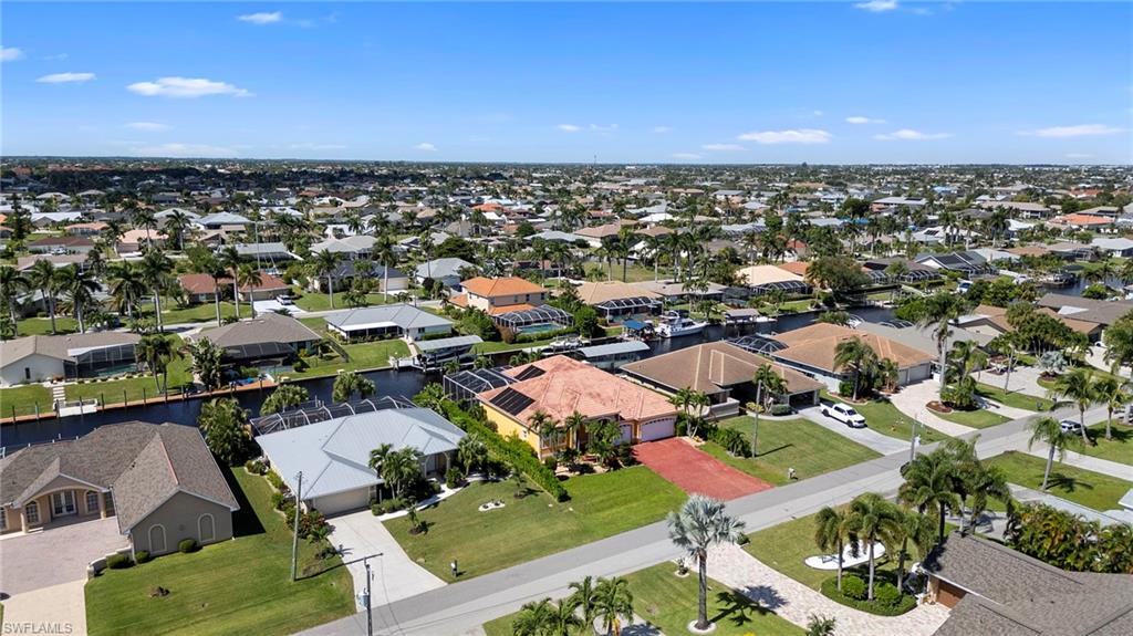 Aerial view of residential area with a nearby body of water