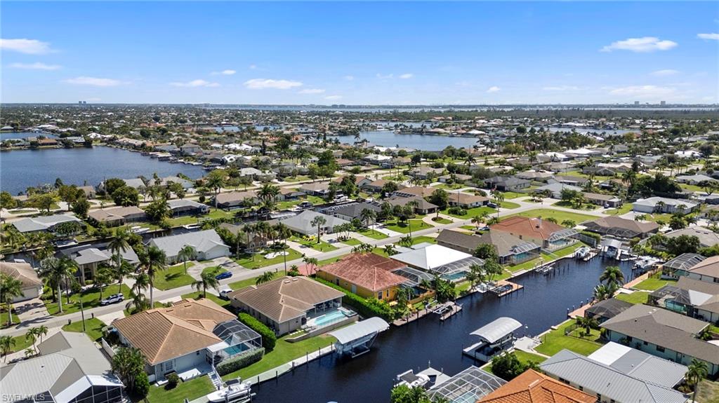 Aerial view of residential area with a nearby body of water