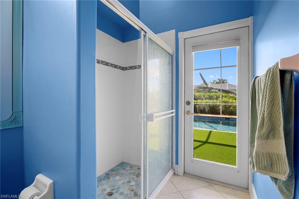 Doorway to outside featuring tile patterned flooring