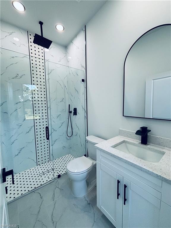 Full bathroom featuring vanity, light marble finish floors, a marble finish shower, and recessed lighting