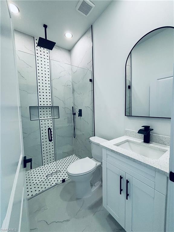 Full bathroom featuring vanity, a marble finish shower, marble look tiles, and recessed lighting