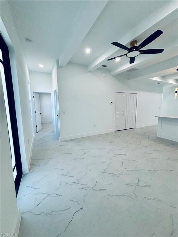 Spare room with beamed ceiling, light marble finish floors, a ceiling fan, and recessed lighting