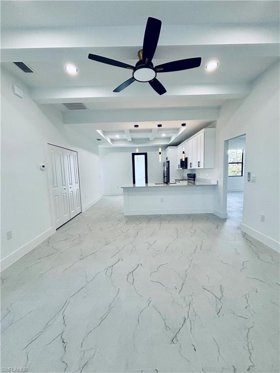 Unfurnished living room with beamed ceiling, recessed lighting, ceiling fan, and light marble finish flooring
