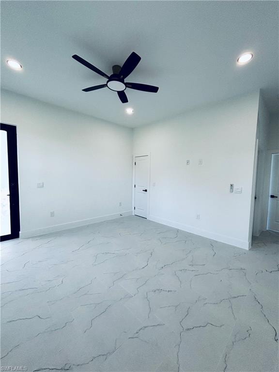 Empty room with recessed lighting and baseboards