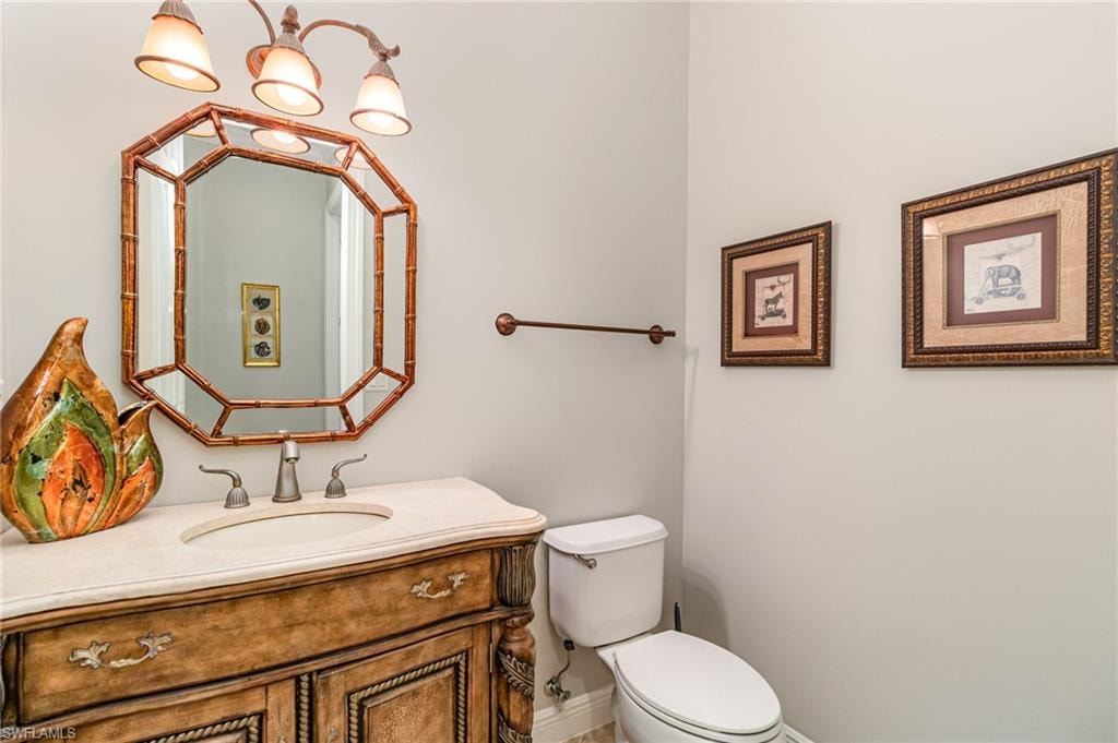 Bathroom featuring vanity and toilet