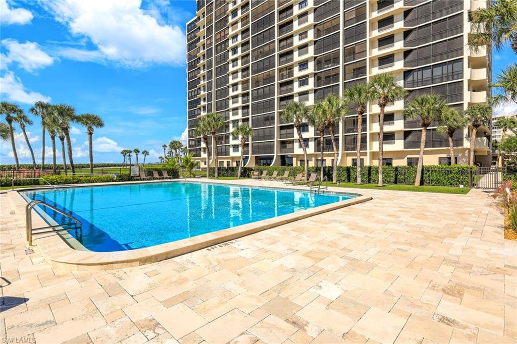 Community pool featuring a patio area
