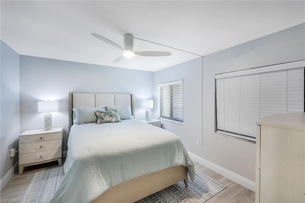 Bedroom featuring light wood-style floors and a ceiling fan