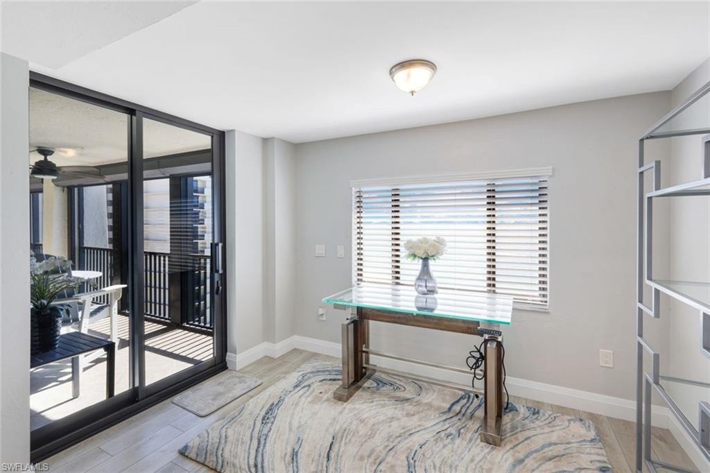 Office space featuring light wood-style floors and baseboards