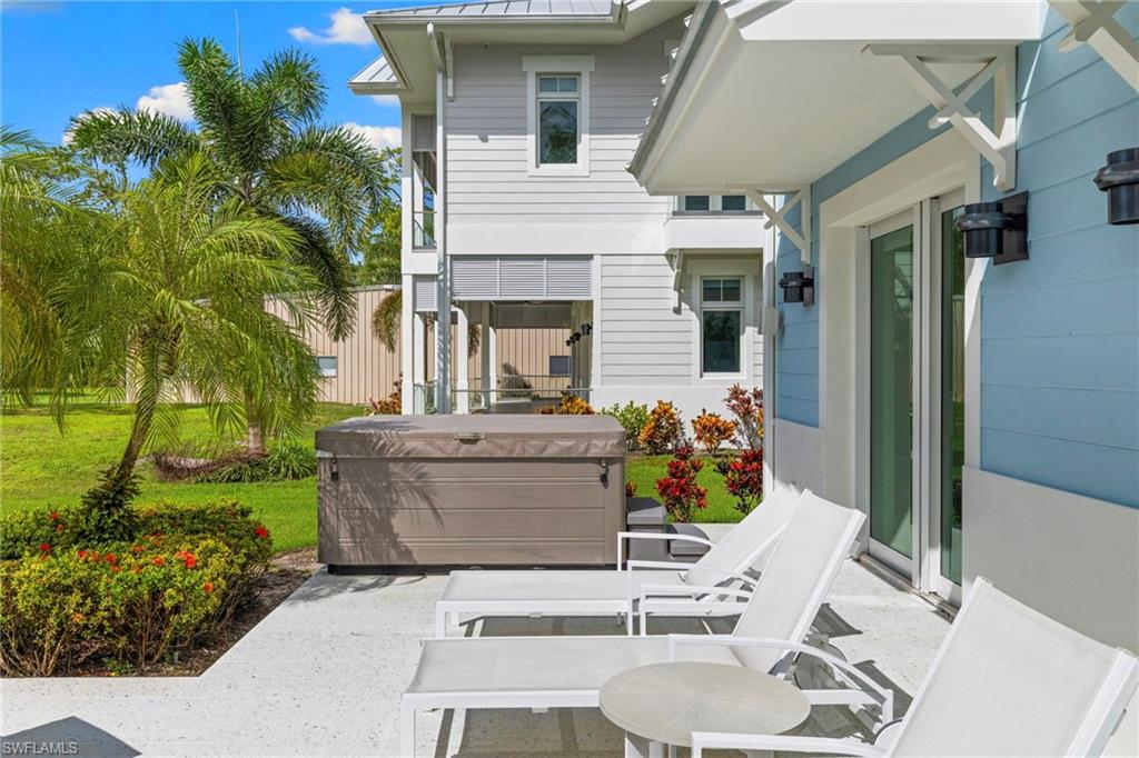 View of patio featuring a hot tub