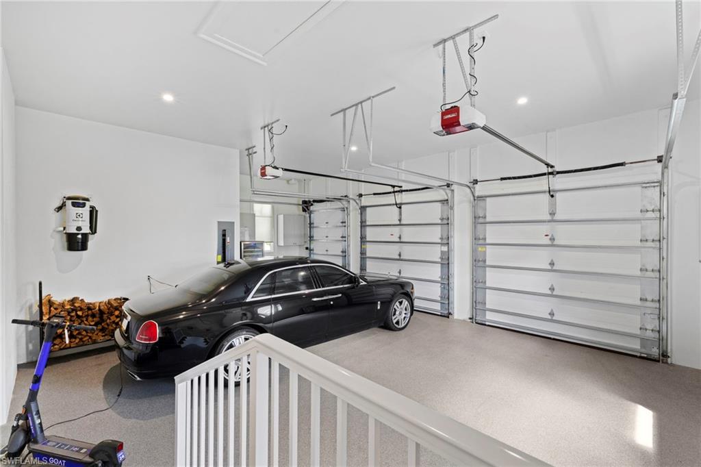 Garage with a garage door opener and electric panel