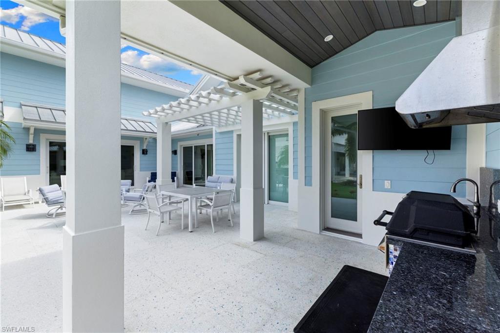 View of patio / terrace featuring outdoor dining area, a pergola, and grilling area