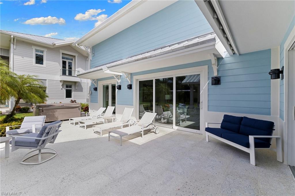 View of patio / terrace with a hot tub