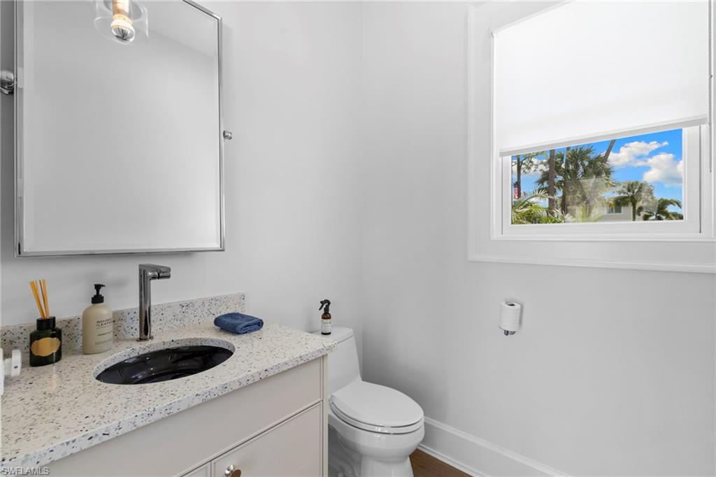 Half bath with vanity and toilet
