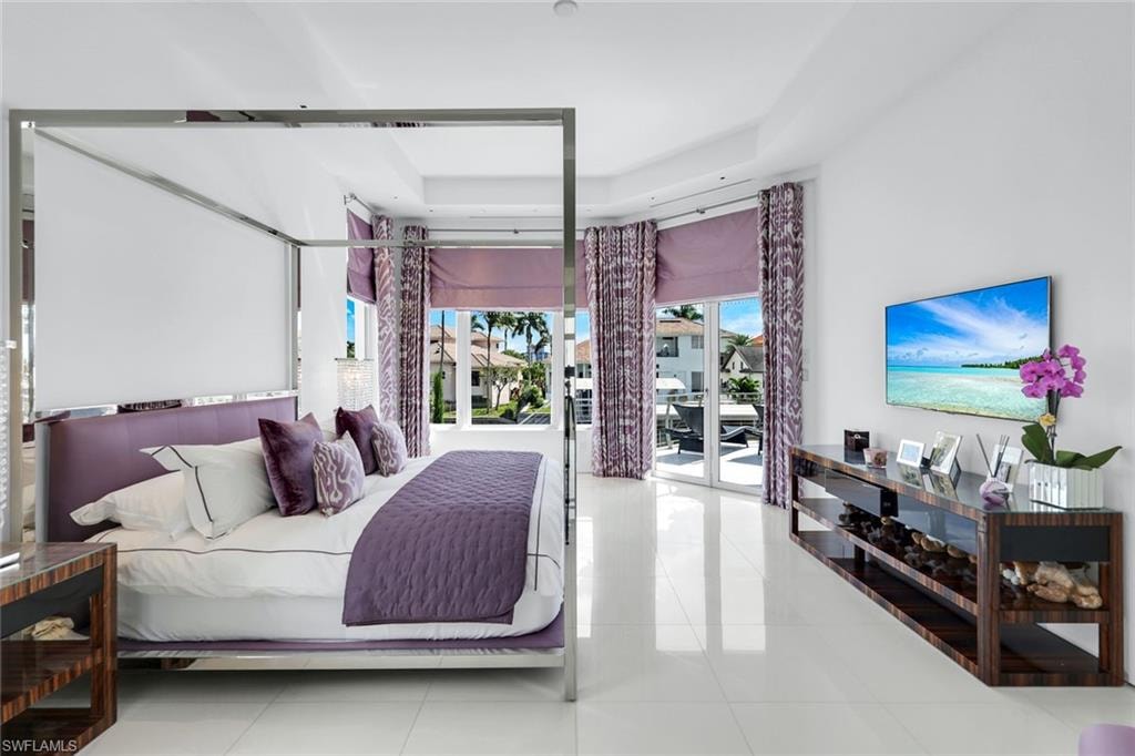 Thassos white marble floors create a bright, elegant, and timeless luxury bedroom
