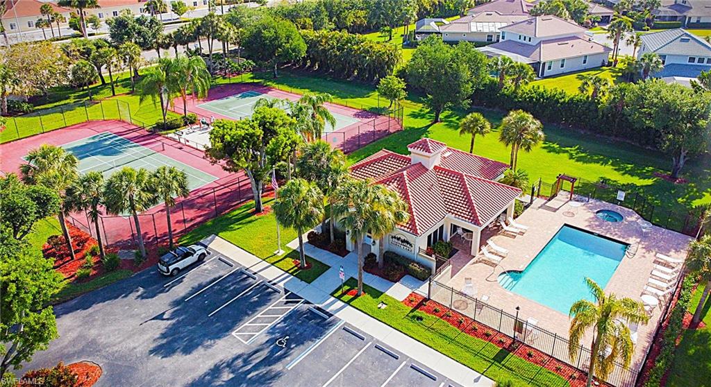Aerial view of residential area featuring a pool