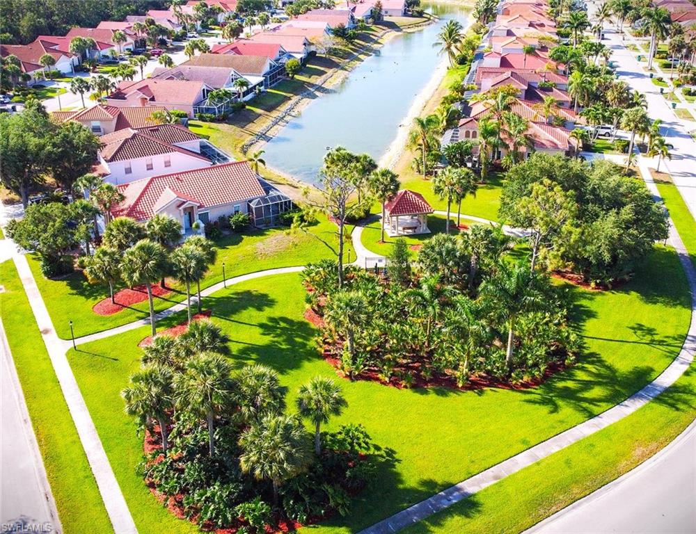 Aerial perspective of suburban area with a large body of water