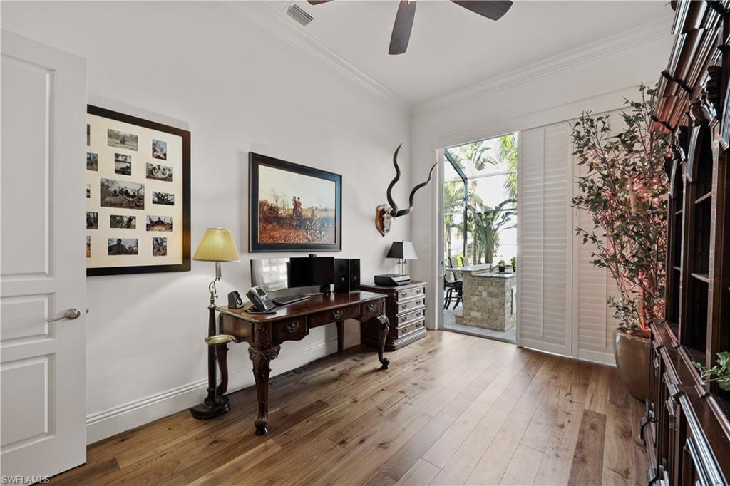 Office with slider to lanai and water view, new wood floor