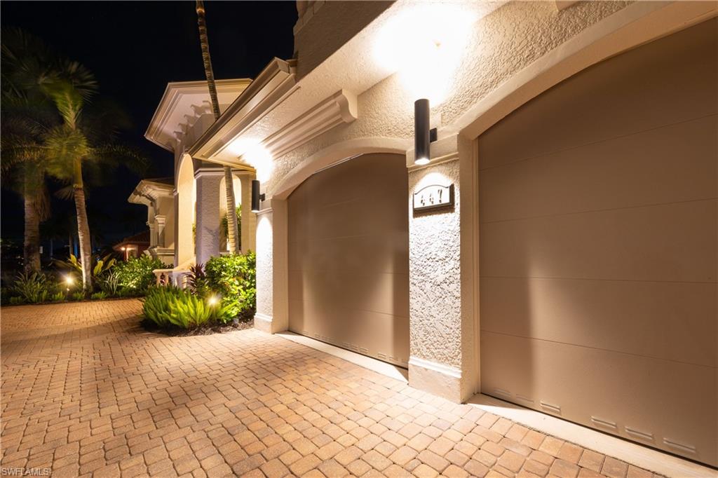 New garage doors, paver circular driveway