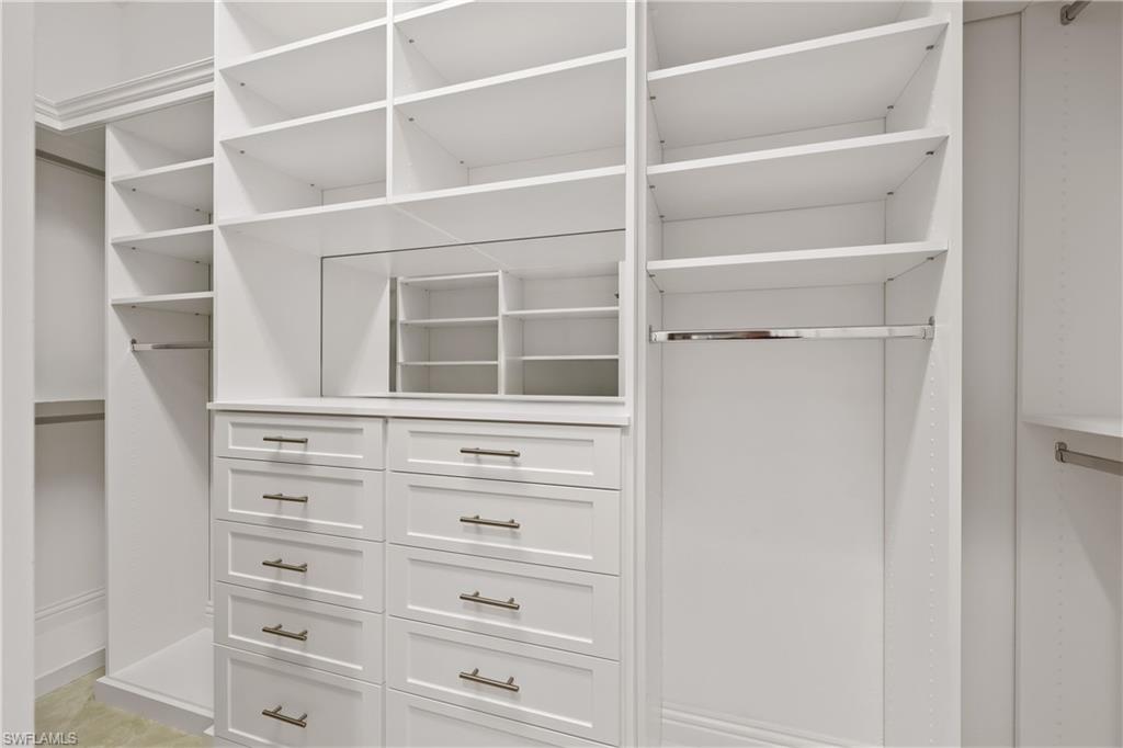 Owners suite features two walk in closets with new custom fixtures