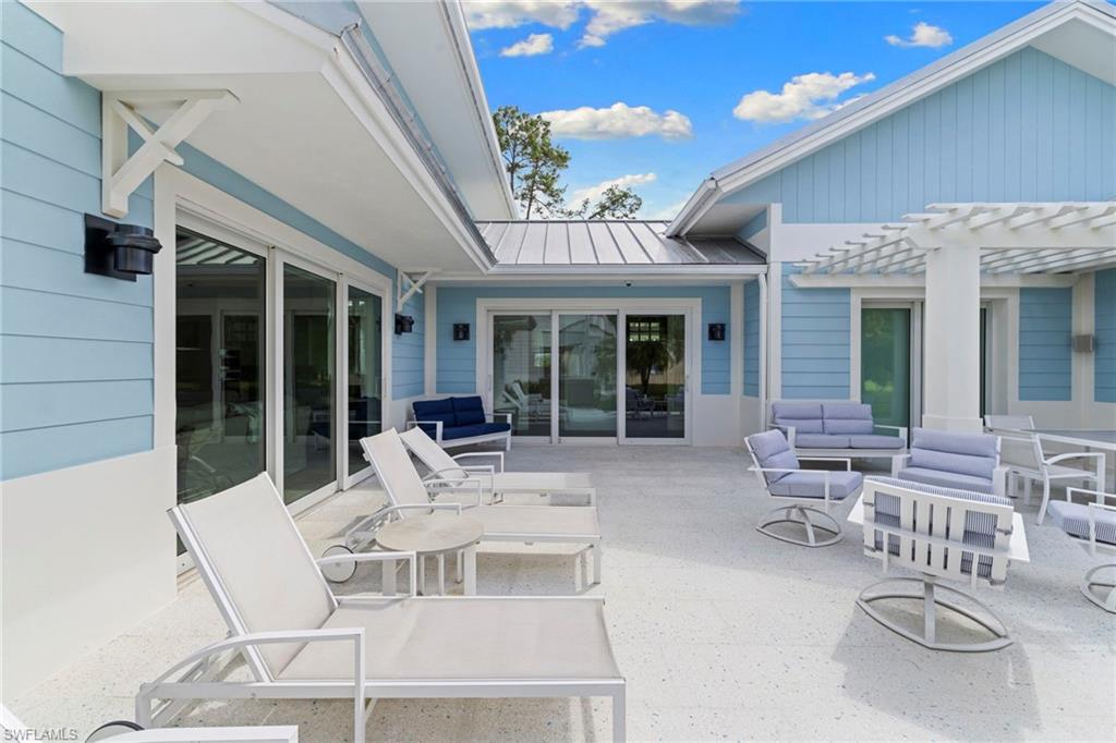 View of patio / terrace with an outdoor living space and a pergola