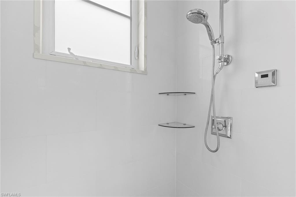 Bathroom view of a tile shower