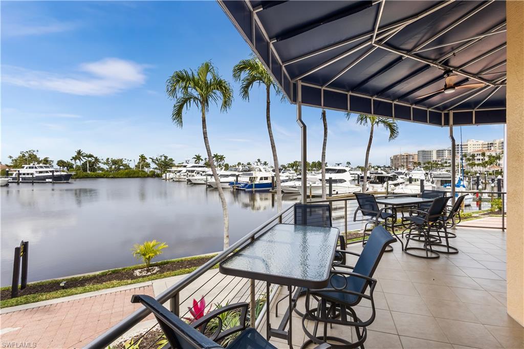 Relax and watch the boats go by on the exterior lanai of the marina clubhouse.