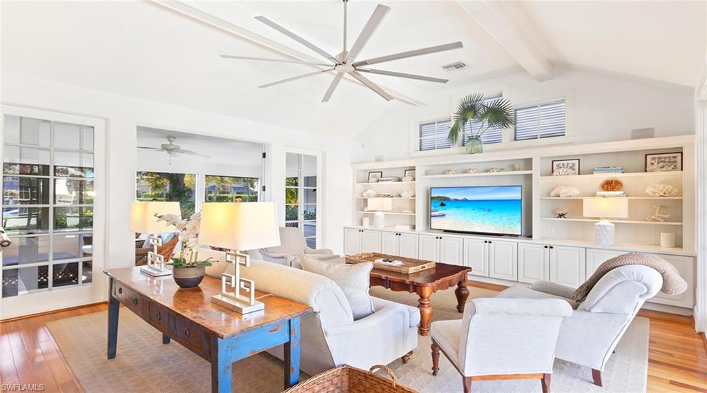 Living area with light wood-style flooring and ceiling fan