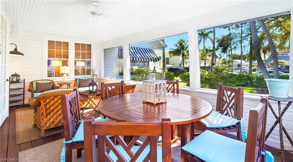 Sunroom with outdoor dining space and vaulted ceiling