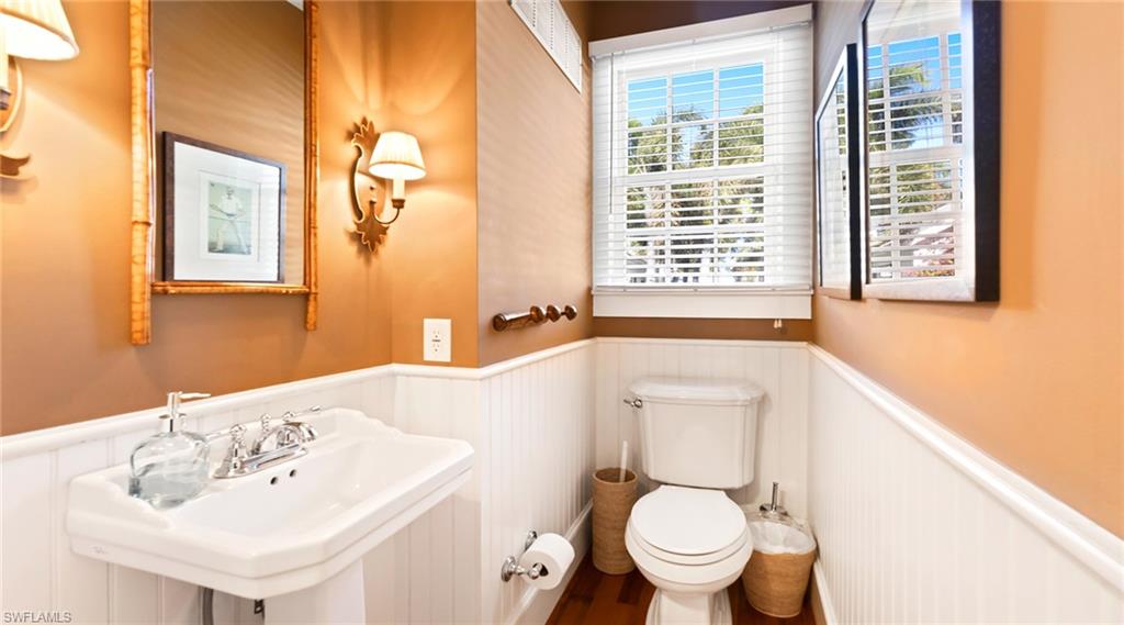 Bathroom featuring a wainscoted wall
