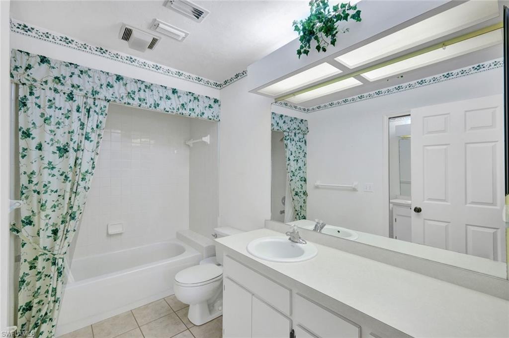Master bath with shower/tub combo, and 2 sink vanity