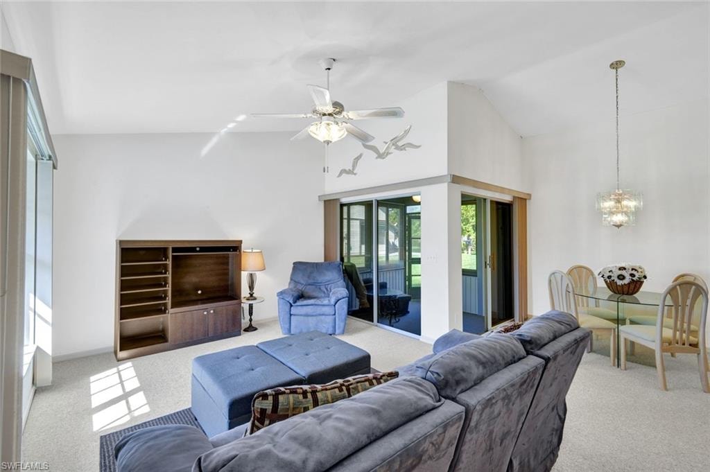 Living room with view of dining area and screened sunroom